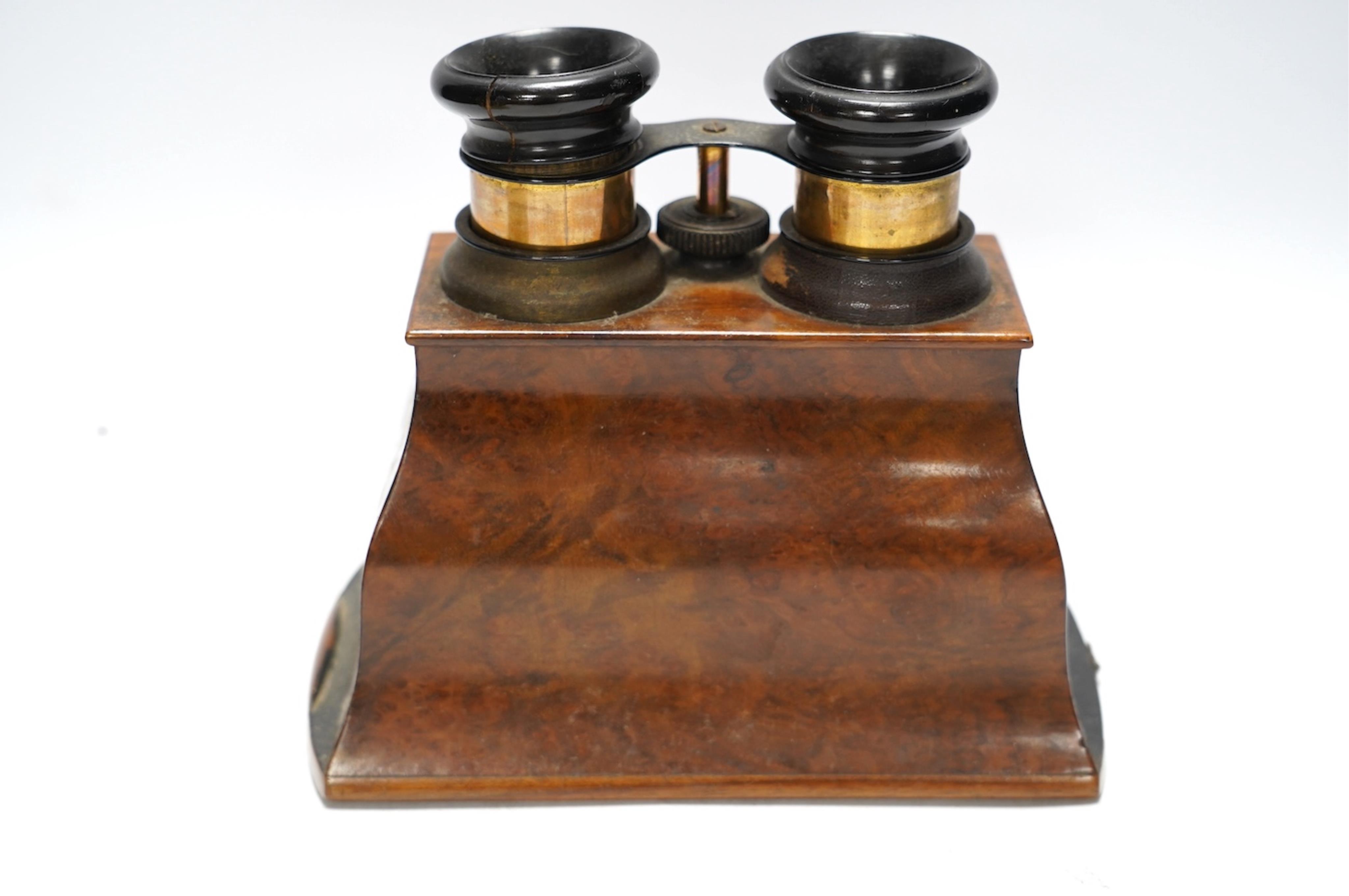 A late 19th century cased stereoscopic viewer together with topographical and other cards. Condition - fair